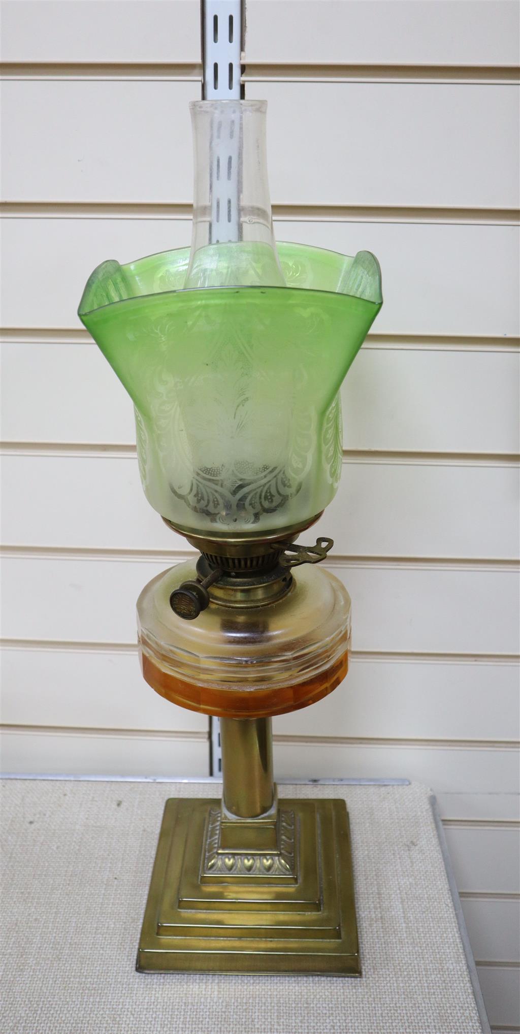 An Edwardian brass and glass oil lamp